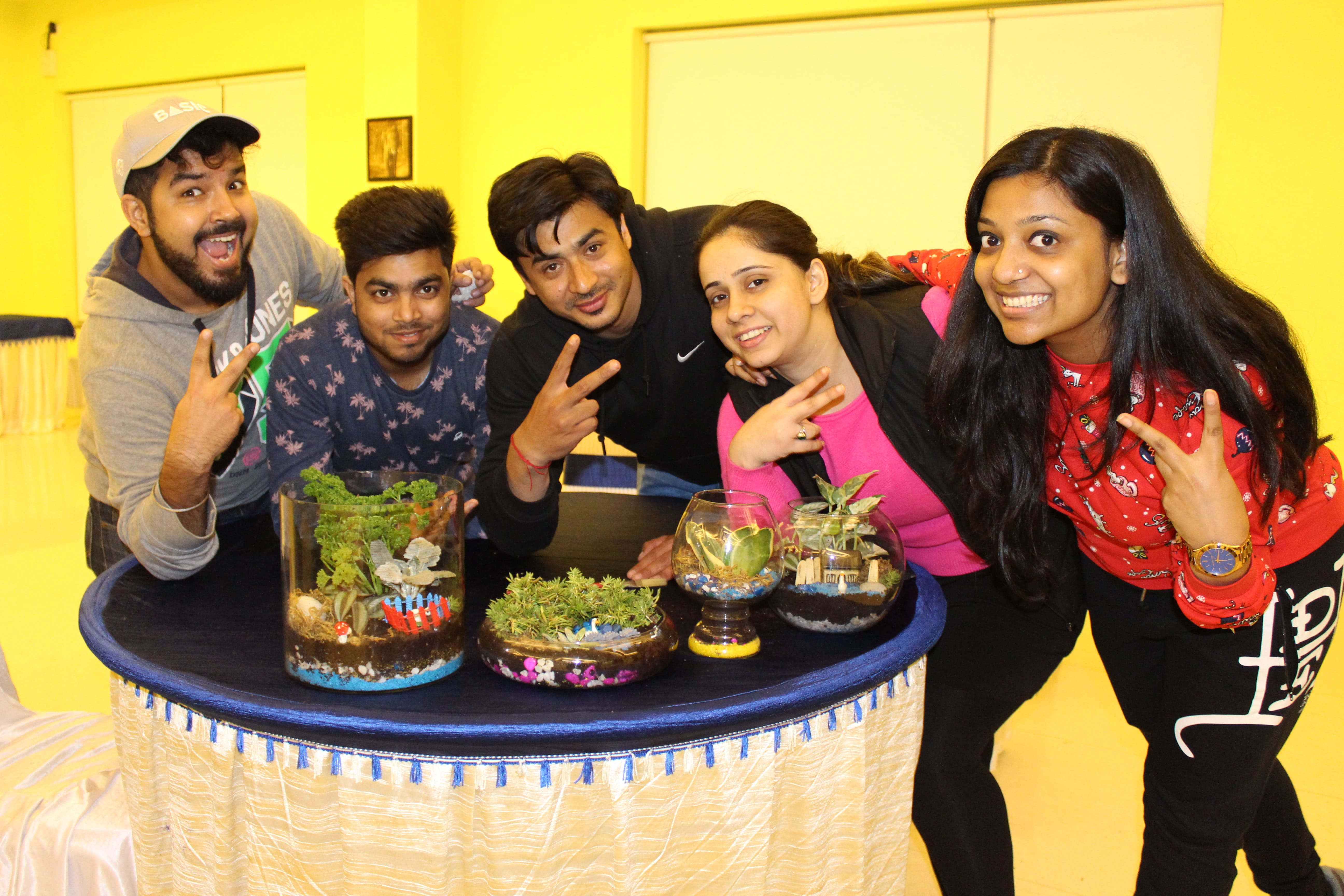 Participants enjoying a DIY Terrarium activity at The Thought Bulb